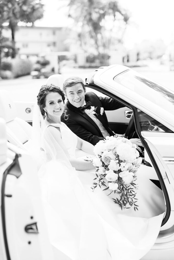 the groom and bride in their car
